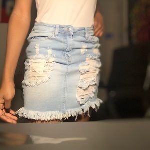 ripped light washed skirt